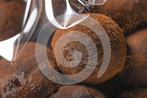 Closeup macro of chocolate truffles in plastic bags