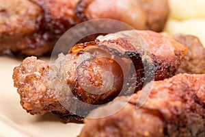 Closeup macro kebabs grilled in bacon