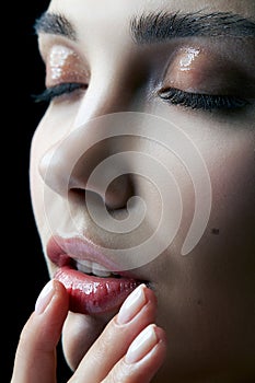 Closeup macro portrait of female face with eyes closed. Woman wi