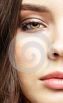 Closeup macro portrait of female face with pink lips and smoky eyes beauty makeup