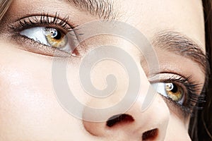 Closeup macro portrait of female face with  smoky eyes beauty makeup
