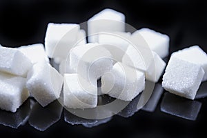 Closeup Macro Shoot of White Cube Sugar Placed Bulk Against Black Background