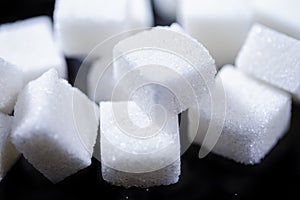 Closeup Macro Shoot of White Cube Sugar Placed Bulk Against Black Background