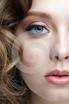 Closeup macro shot of blue human female eye. Woman with natural face beauty makeup