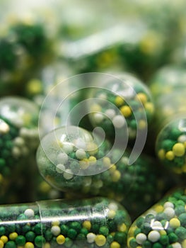 closeup macro shot of edible capsules with pills