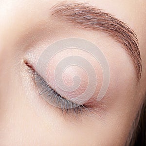 Closeup macro shot of human female closed eye with makeop