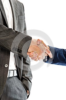 Closeup of male and female business partners shaking hands