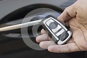 Closeup of male hand holding remote car key