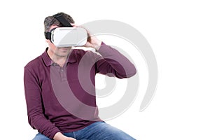 Closeup of male young man wearing virtual reality goggles smartphone using with VR headset in office Horizontal