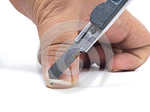 Closeup of a man cutting nails by rusty cutter