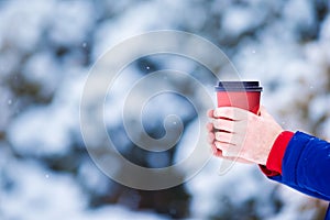 Closeup man drinking coffee in frozen winter day
