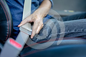 Closeup of man fastening seat belt in car, Safety belt safety first