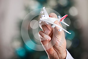 Closeup of man hand holding model of airplane