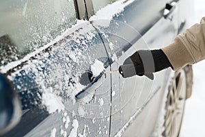 Closeup of man hand opening car with key