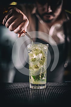 Man hands pouring alcoholic drink