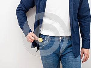 Closeup man pick up money from jean pocket on white background digital money concept