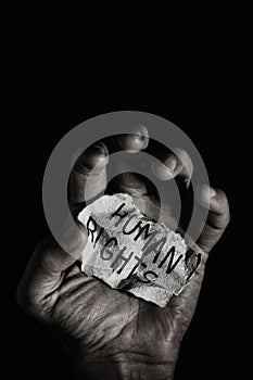 Has a piece of paper with the text human rights