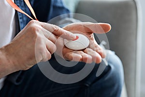 Closeup Of Man's Hand Pressing Alarm Button For Emergency