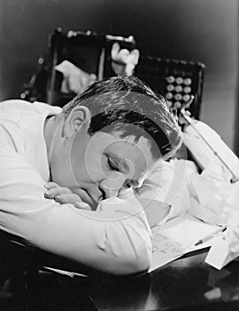 Closeup of man sleeping at his desk