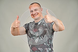 Man with two thumbs up