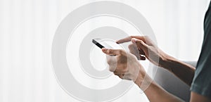 Closeup of man using a smartphone, searching, browsing, social media, message, email, play game, internet digital marketing,