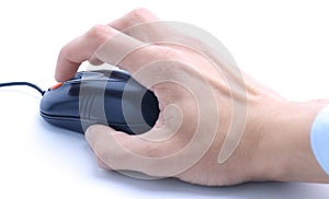 Closeup . man working with outdated computer mouse.