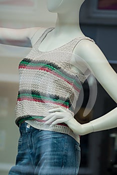 mannequin with blue jeans and pullover in women fash photo