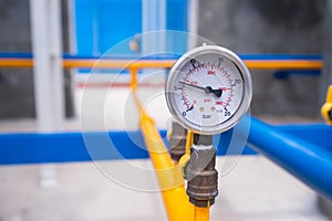 Closeup of manometer for measuring gas pressure. Pipes and valve