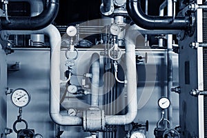 Closeup of manometer, pipes and faucet valves of heating system