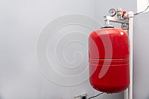 Closeup of manometer, pipes and faucet valves of heating system in a boiler room