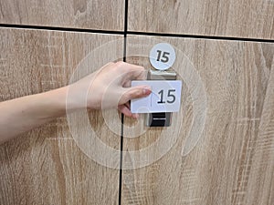 Closeup on manual locker opening in dressing room with electronic card shaped transponder