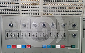 Closeup of many labeled lights & switches on a vintage IBM computer