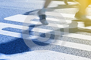 Closeup on marathon runners legs and feet with motion blur