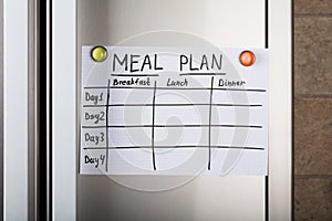 Daily Meal Plan Paper Attached With Magnetic Thumbtacks photo