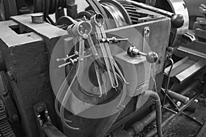 Closeup of a measuring special equipment like calipers, dividers & compass of old Lathe Machinery. Vintage Industrial Machinery in