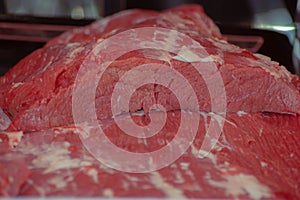 a closeup of meat on the cutting board near the meat