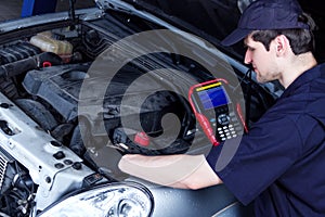 Mechanic engineer repair car at car service station