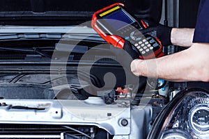 Mechanic engineer repair car at car service station