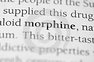 Closeup of the medical or addictive pharmacology term 'Morphine' in black on white paper