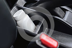 Medicine Bottle Inside a Car , using medication before driving concept photo