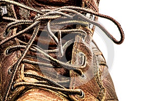 Closeup of Men`s Dirty Beat Up Brown Leather Work Boots Isolated on White