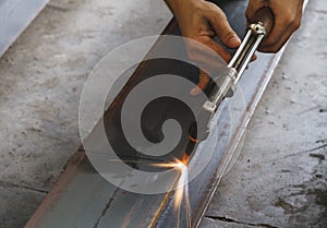 Closeup metal cutter, steel cutting with acetylene torch.