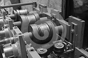 Closeup of a metal shaft parts of Lathe Machinery. Vintage Industrial Machinery.