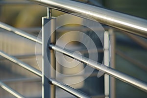 closeup of metal staircase handrail with weld seams