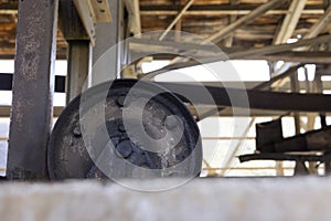 Closeup of metallic rusted turning wheel from coal mining cableway industrial equipment