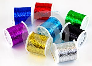 Closeup Of Metallic Thread Bobbins 