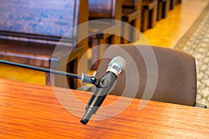 Closeup of microphone in the courthouse. Justice system, witness testimony. Nobody