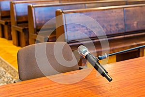 Closeup of microphone in the courthouse. Justice system, witness testimony. Nobody