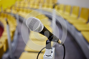 Closeup microphone on holder in conference room, photo