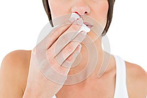 Closeup mid section of a woman with bleeding nose